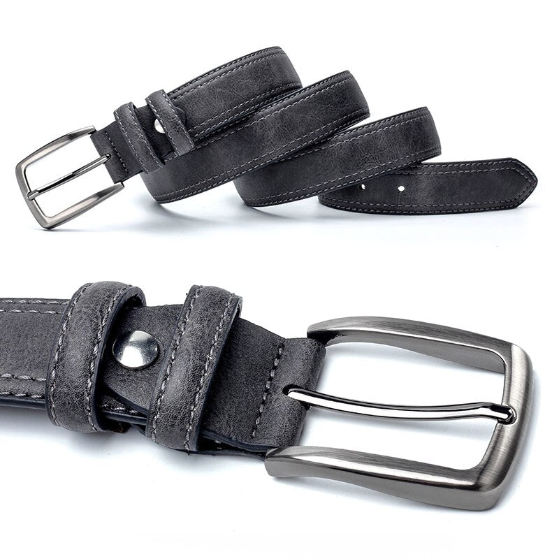 Gray suede belt with silver buckle on a white background