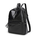 Black leather backpack on a white background