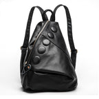 Black leather backpack with button details on a white background
