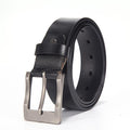 Black leather belt with a silver buckle on a white background