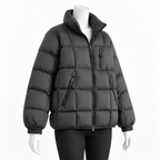 Dark Gray - A black puffer jacket with horizontal quilting, a high collar, and zippered pockets, displayed on a white mannequin against a plain white background.