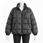 Dark Gray - A dark gray puffer jacket with a high collar, front zipper, and zippered pockets, displayed on a white mannequin against a plain white background.