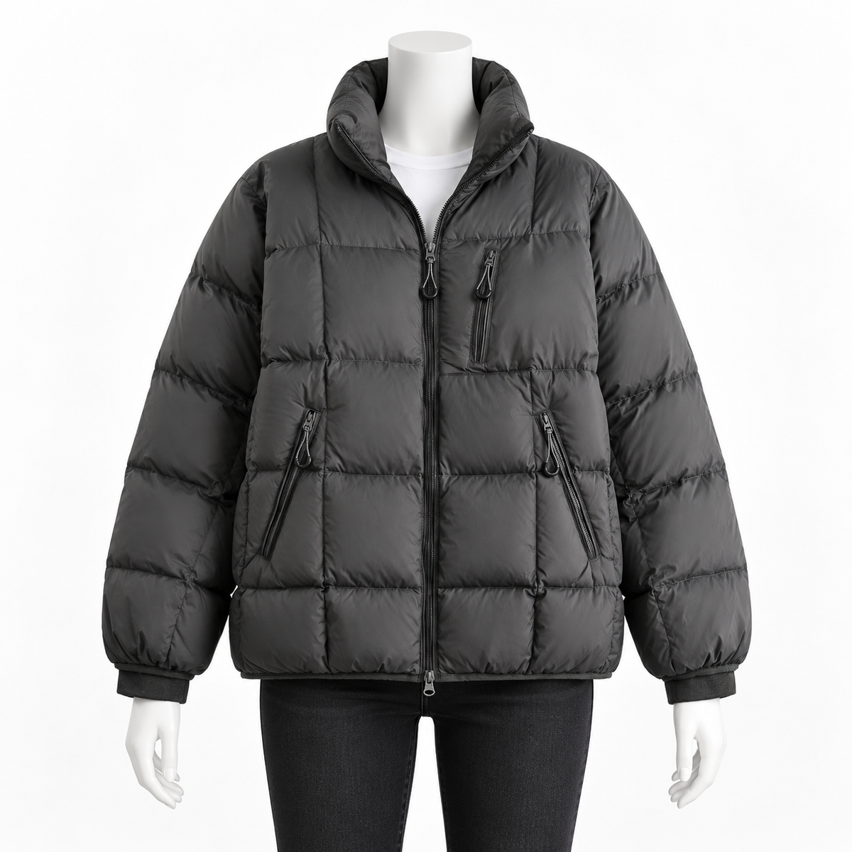 Dark Gray - A dark gray puffer jacket with a high collar, front zipper, and zippered pockets, displayed on a white mannequin against a plain white background.