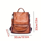 A brown faux-leather backpack shown on a white background with red dimension lines and text indicating measurements: 33cm/13in height, 32cm/12.6in width, and 15cm/5.