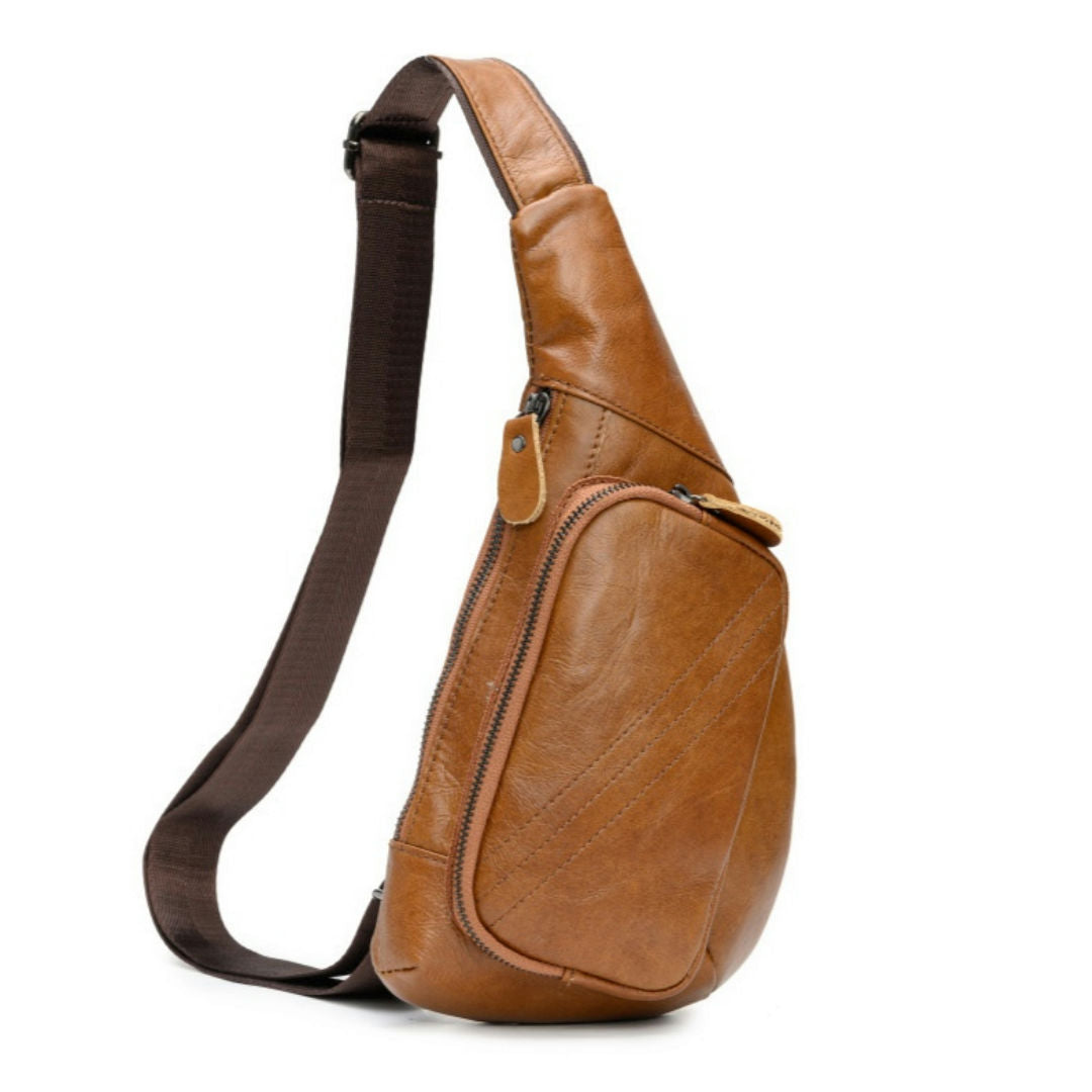 Brown leather sling bag on a white background