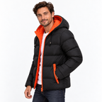 Orange - A man wearing a black puffer jacket with a bright orange hood lining and orange zipper accents, paired with a white t-shirt and dark jeans, against a plain white studio background.