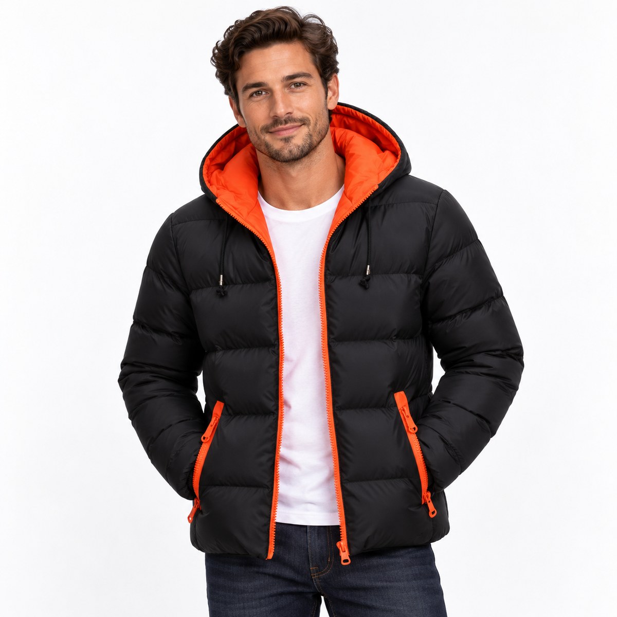 Orange - A man wearing a black puffer jacket with a bright orange hood lining and orange zipper accents, layered over a white t-shirt and dark jeans, against a plain white background.