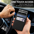 A black slim cardholder wallet held in a hand inside a car, with text reading 'ONE TOUCH ACCESS' and a demonstration of cards popping out. The wallet contains ID cards and a £20 note.