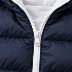 Navy Blue - Close-up of a navy blue puffer jacket with a white zipper and white inner lining.
