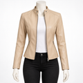 Apricot - A beige faux-leather moto jacket with a stand collar and front zipper, displayed on a white mannequin torso wearing a white top and black jeans against a white background.