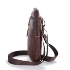 Brown leather crossbody bag on a white background
