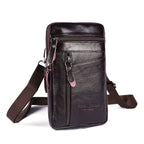 Black leather crossbody bag with a strap on a white background