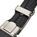 Close-up of a black leather belt with a silver buckle on a white background