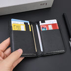 Black vegan leather card holder held open to show the internal card slots.