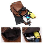 Brown leather waist bag with various items on a white background