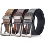 Four belts in different colors with silver buckles on a white background