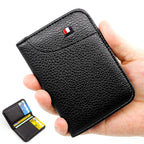 Black vegan leather card holder held in one hand, with an inset showing the open card slots.