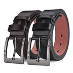 Two black leather belts with silver buckles on a white background