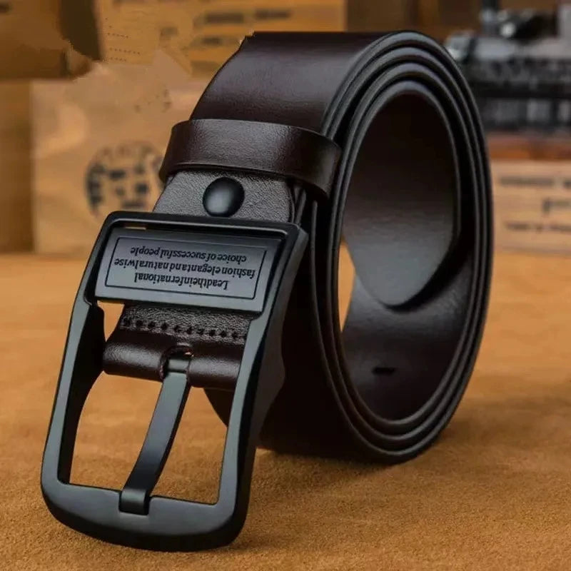 Brown leather belt with black buckle on a brown surface