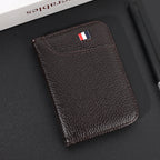 Coffee vegan leather card holder showing its curved outer pocket and stitched edges.