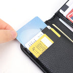 Close-up of a hand removing a card from the black vegan leather card holder.