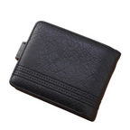 A black textured leather bifold wallet with decorative stitching, displayed on a light wood surface next to a white smartphone, with neutral-colored boxes in the background.