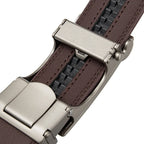 Close-up of a brown leather watch strap with a silver buckle on a white background