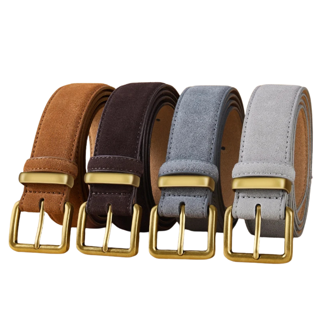 Four rolled belts in tan, dark brown, light blue, and light gray suede-like material, each with a gold-tone buckle, arranged side by side on a white background.