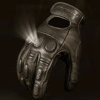 Leather glove with a flashlight on a dark background